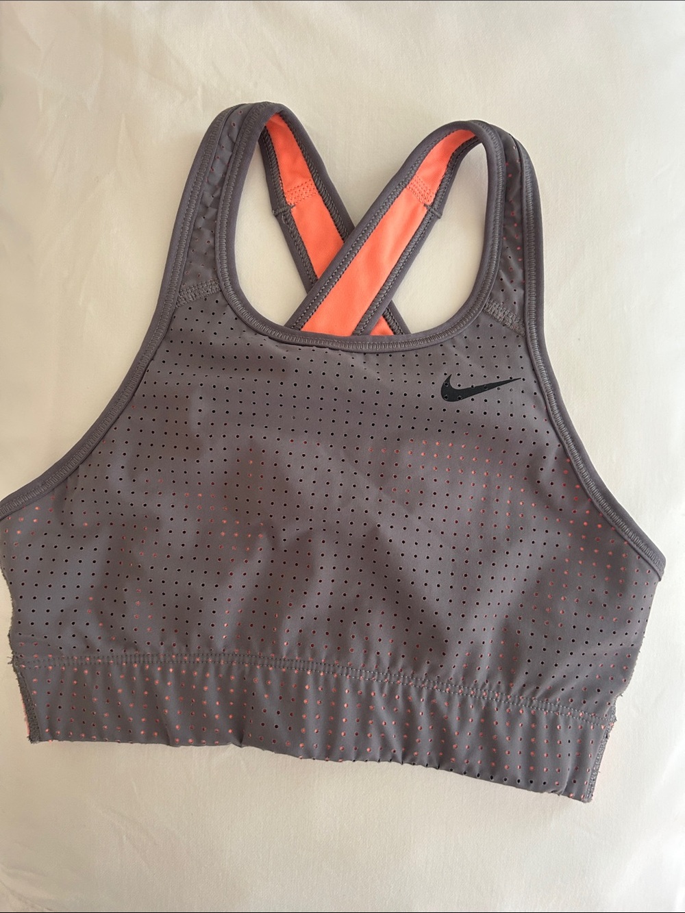 Nike Gray Sports Bra with Coral Lining and Perforated Design
